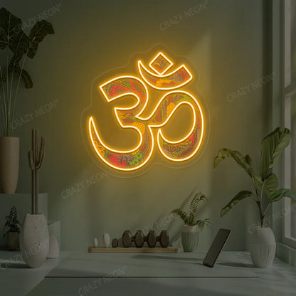 Psychedelic OM Neon Artwork lighting up in orange color in a yoga room