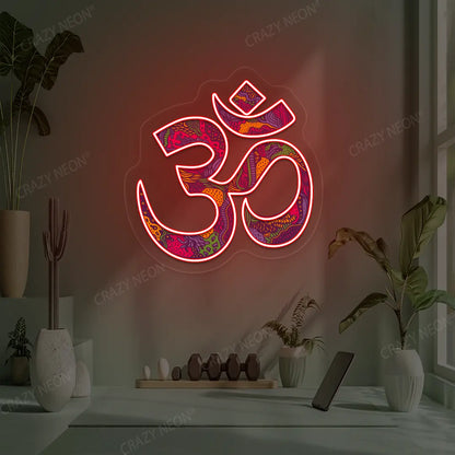 Psychedelic OM Neon Artwork lighting up in red color in a yoga room