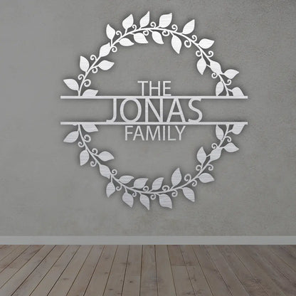 Metal Last Name Sign For Home in Silver colour mounted on wall 