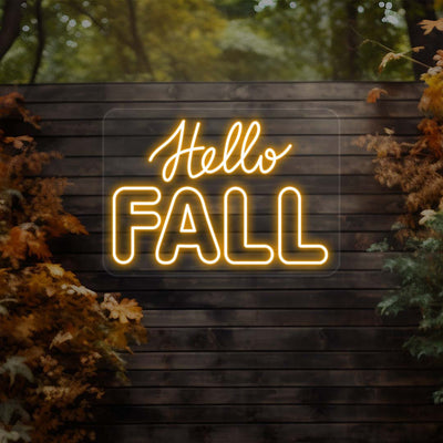 Hello Fall neon sign in orange on dark wood outdoor wall with autumn leaves