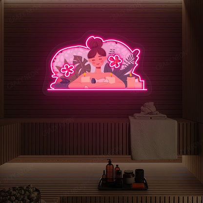 Aromatherapy Relaxation Neon Artwork lighting up in pink color on a wooden spa wall