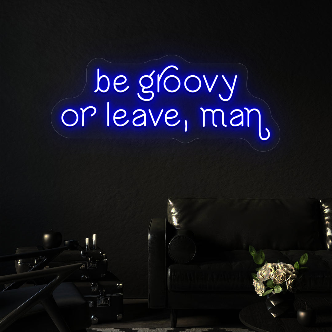 blue be groovy or leave, man vintage neon sign mounted on a wall