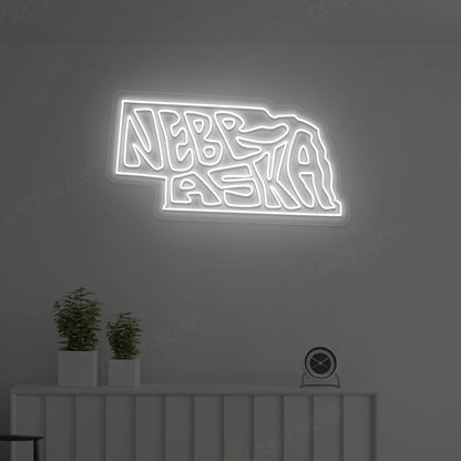 NEBRASKA Map Neon Sign lighting up in white color in a room