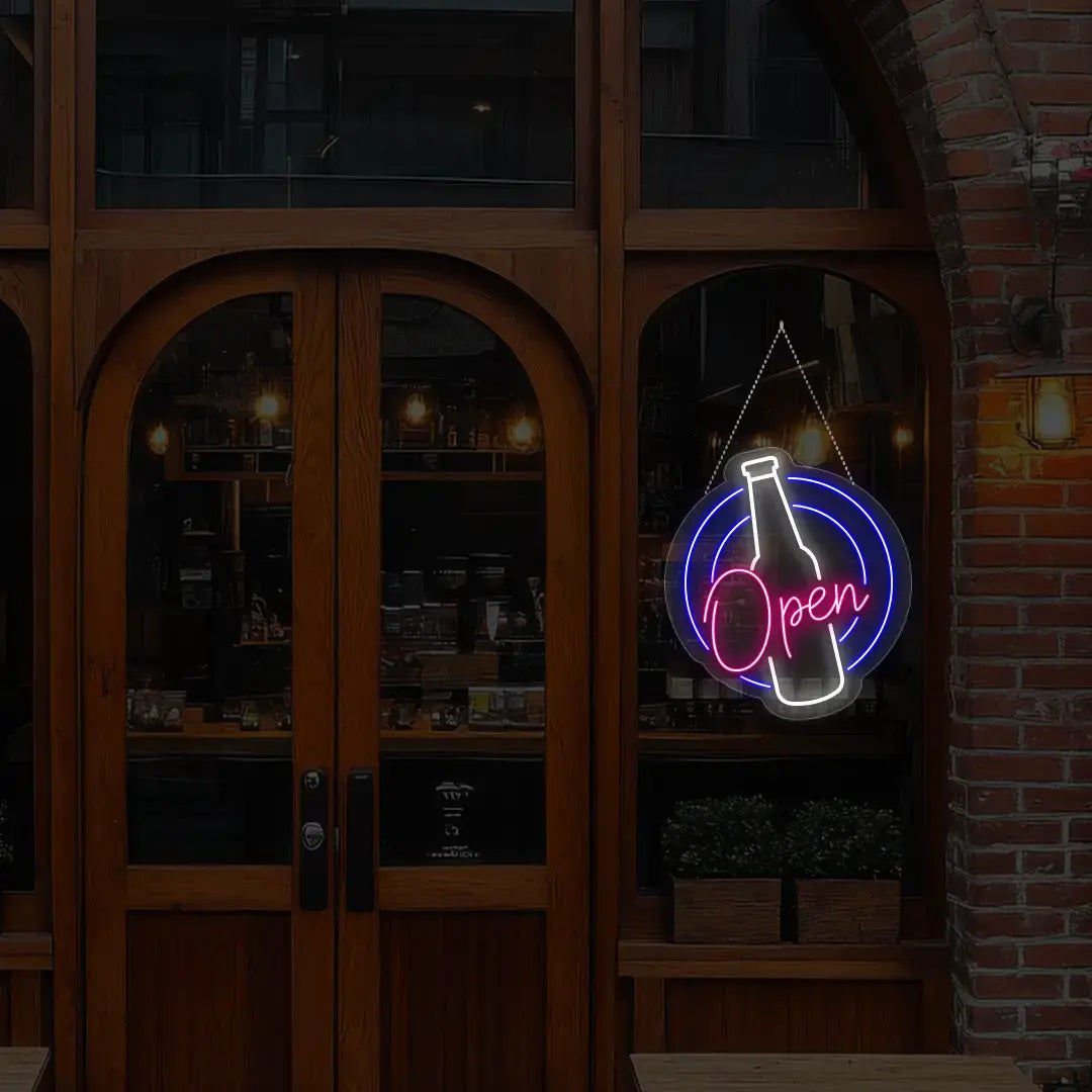 pink beer open neon sign hanging on a window
