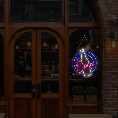pink beer open neon sign hanging on a window