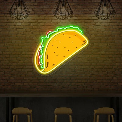 A taco neon sign on exposed brick wall