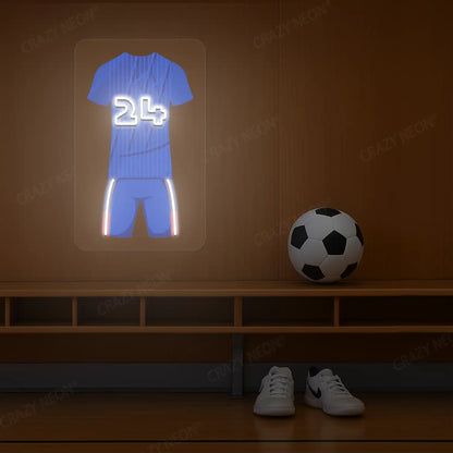 Blue football jersey neon artwork with number 24 glowing on a wooden wall