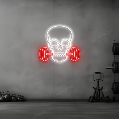 red and white skull barbell gym neon sign mounted on a wall