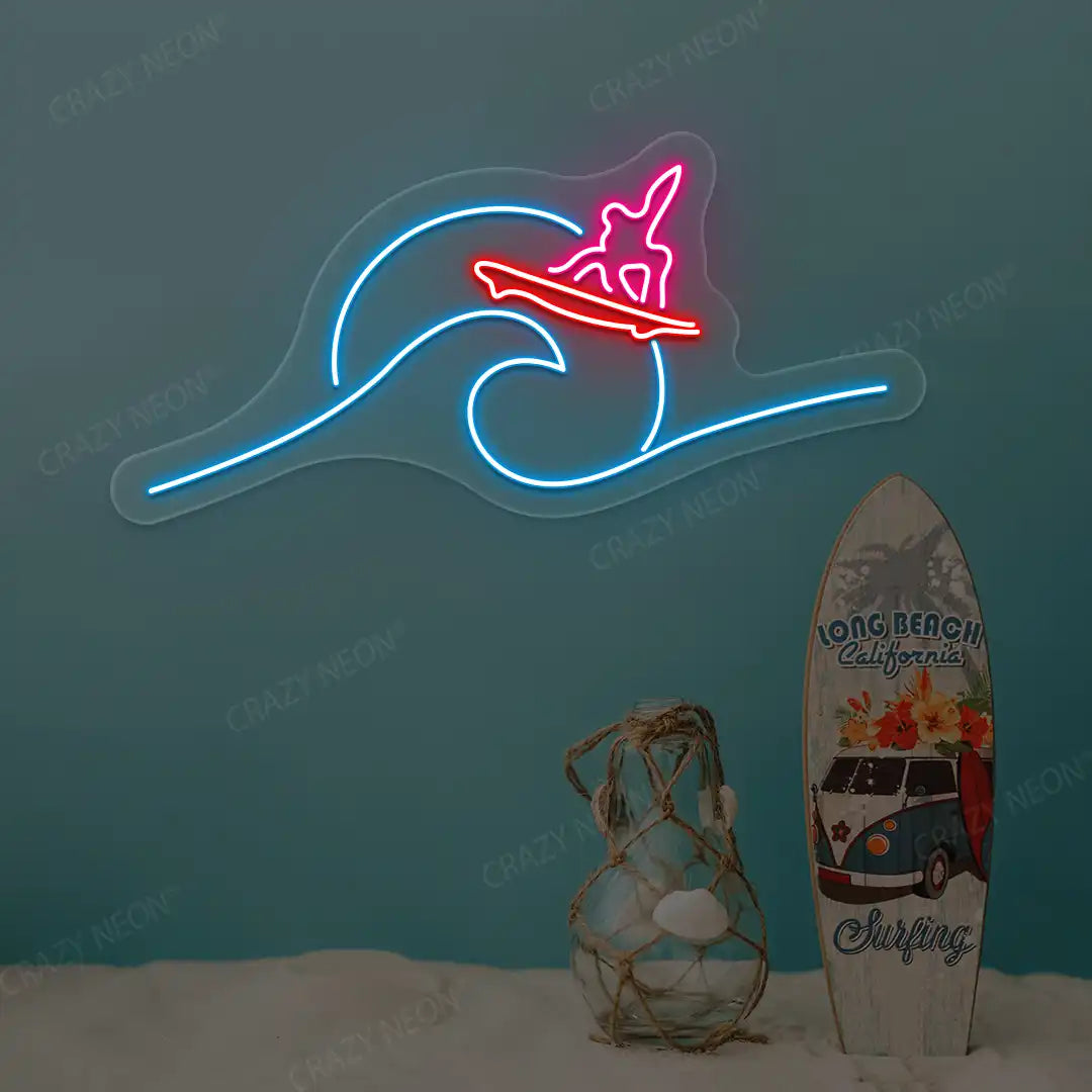 pink red and ice blue surfer riding wave neon sign mounted on a wall