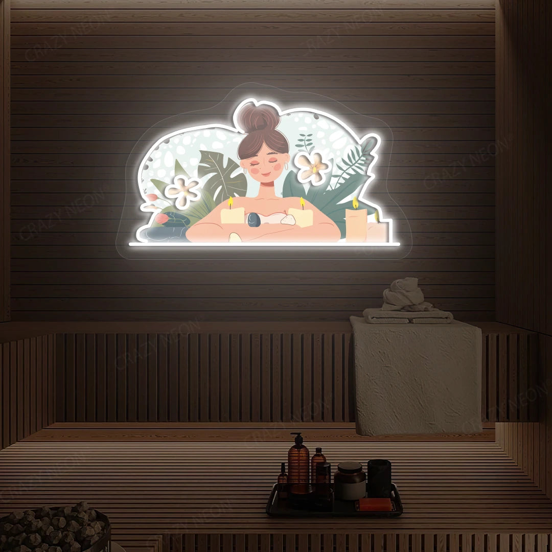 Aromatherapy Relaxation Neon Artwork lighting up in white color on a wooden spa wall