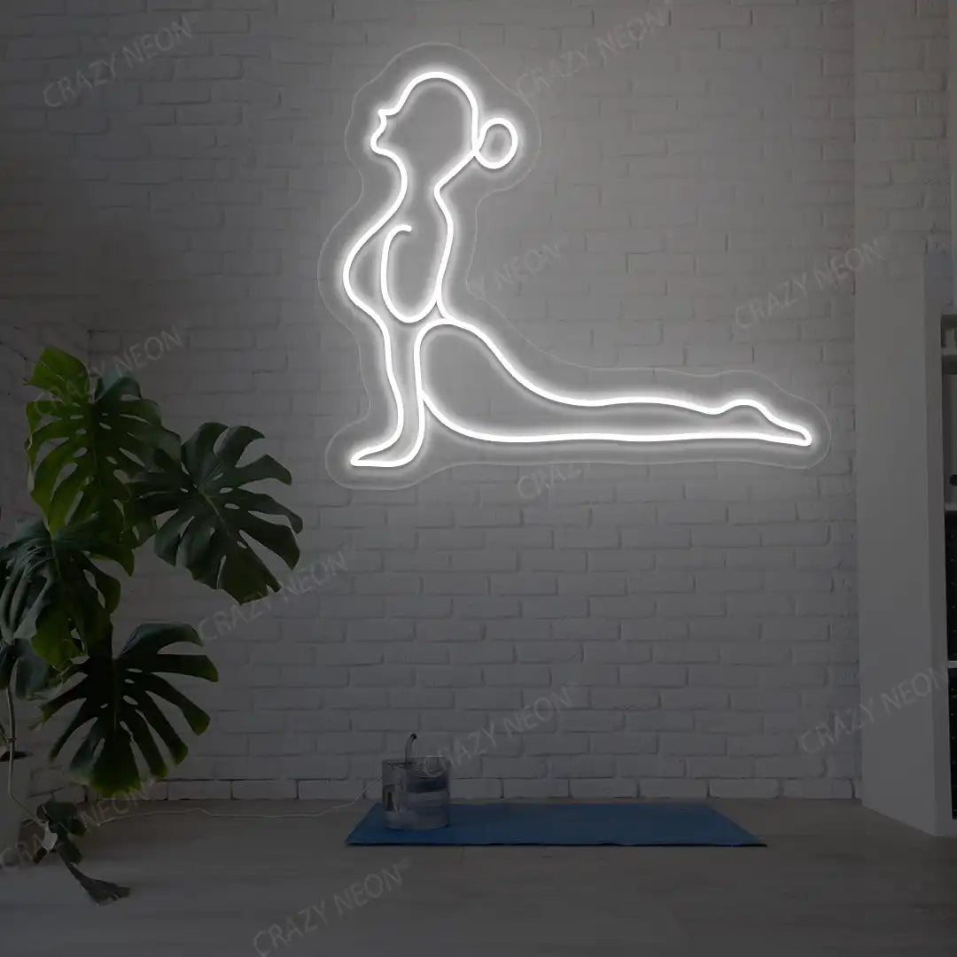 Bhujangasana Yoga Neon Sign glowing in white color in a yoga room