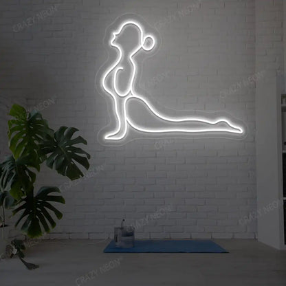 Bhujangasana Yoga Neon Sign glowing in white color in a yoga room