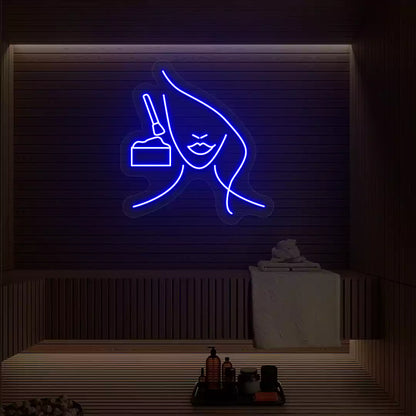 Blue Facial Retreat neon sign glowing on a wooden wall