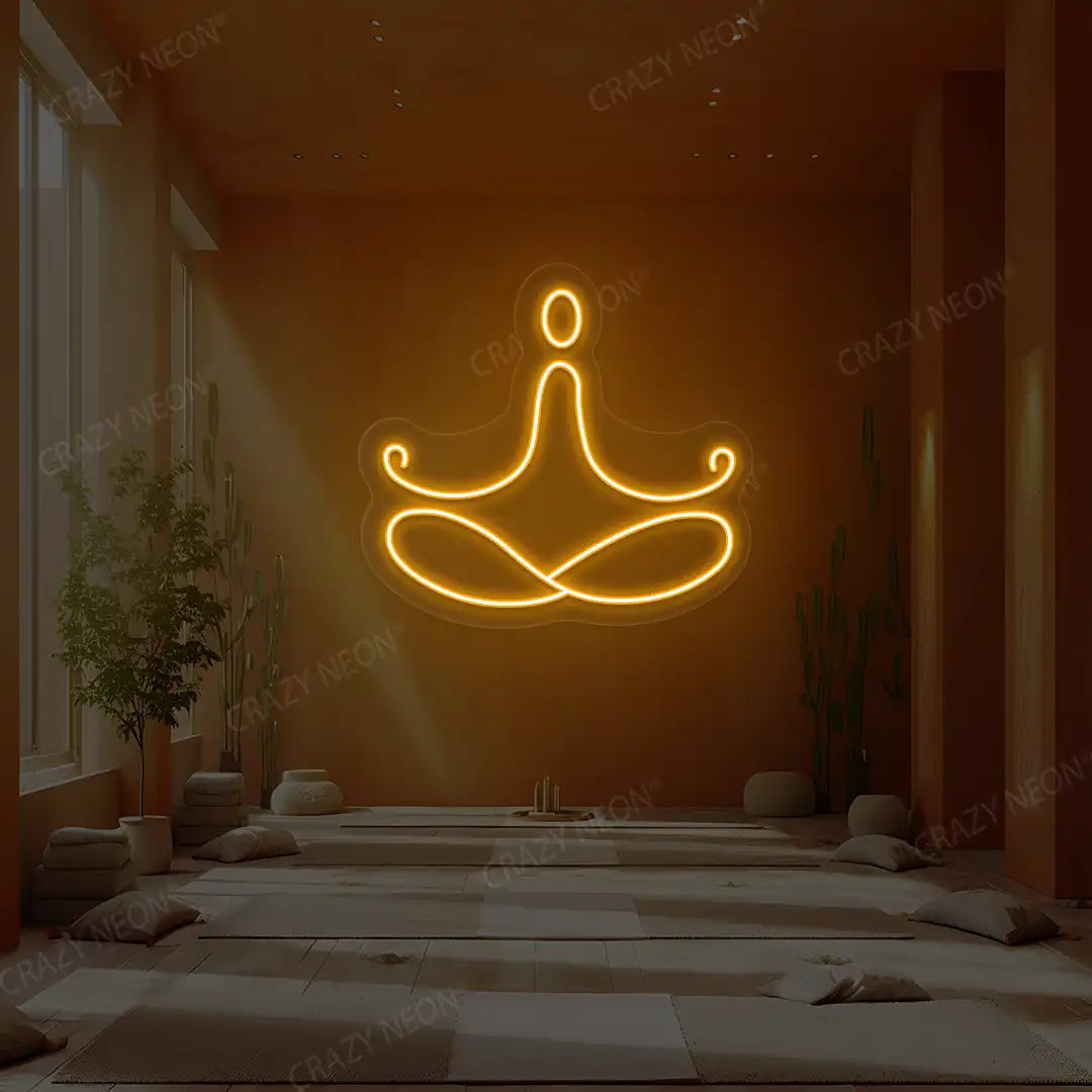Padmasana Yoga Neon Sign lighting up in orange color in a yoga room