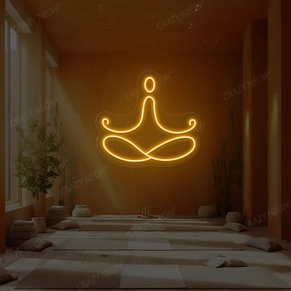 Padmasana Yoga Neon Sign lighting up in orange color in a yoga room