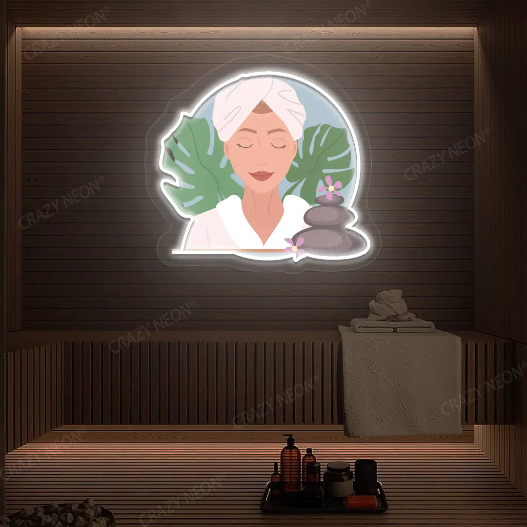 Zen Facial Spa Neon Artwork lighting up in white color on a wooden spa wall