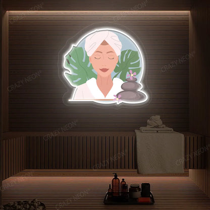 Zen Facial Spa Neon Artwork lighting up in white color on a wooden spa wall