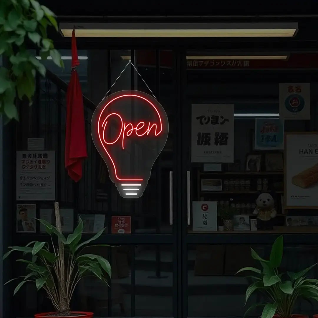 red bulb open neon sign hanging on a window