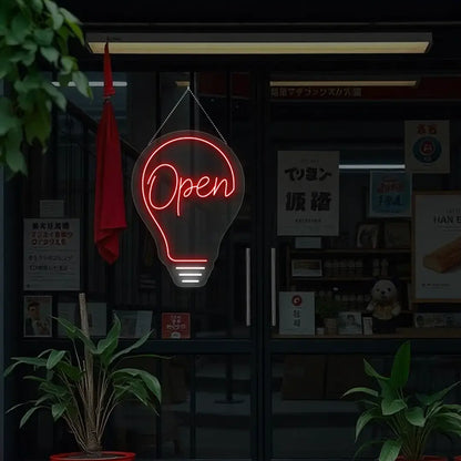 red bulb open neon sign hanging on a window