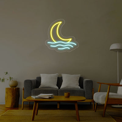 A yellow neon crescent moon glows above wavy ice blue neon lines representing water set on a neutral wall