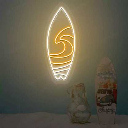 orange and white surfboard beach neon sign mounted on a wall