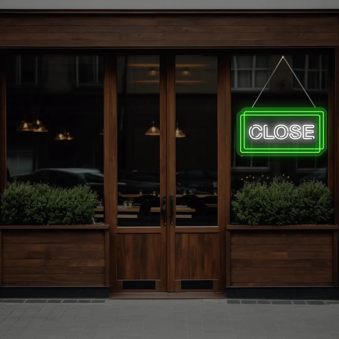 green close neon sign hanging on a  window