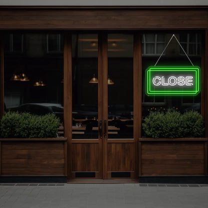 green close neon sign hanging on a  window