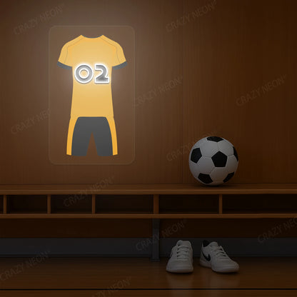 Yellow football jersey neon artwork with number 02 glowing on a wooden wall