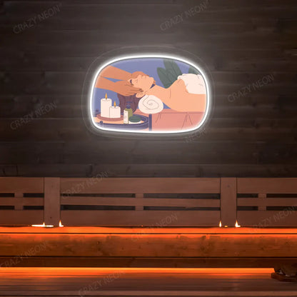Relaxation Massage Neon Artwork lighting up in warm white color on a wooden spa wall