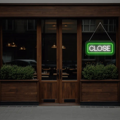 horizontal close neon sign glowing in green color on a window