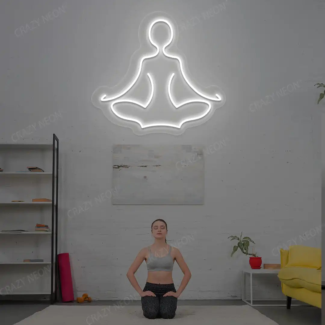 Sukhasana Yoga Neon Sign lighting up in white color in a yoga room
