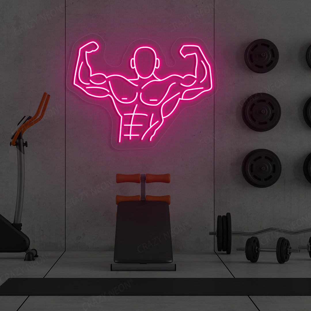 pink flexing bodybuilder gym neon sign mounted on a wall