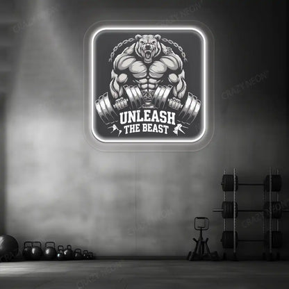 white unleash the beast bear neon artwork mounted on a wall