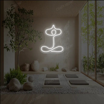 Sukhasana With Arms Raised Contour Yoga Neon Sign glowing in warm white color in a yoga room