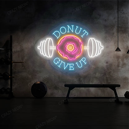 multi color donut give up gym neon sign mounted on a wall  