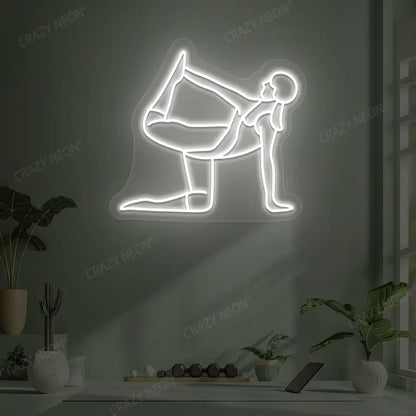 Ardha Dhanurasana Yoga Neon Sign glowing in white color in a yoga room