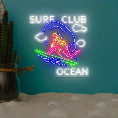 multi color stunt girl surf club ocean neon sign mounted on a wall