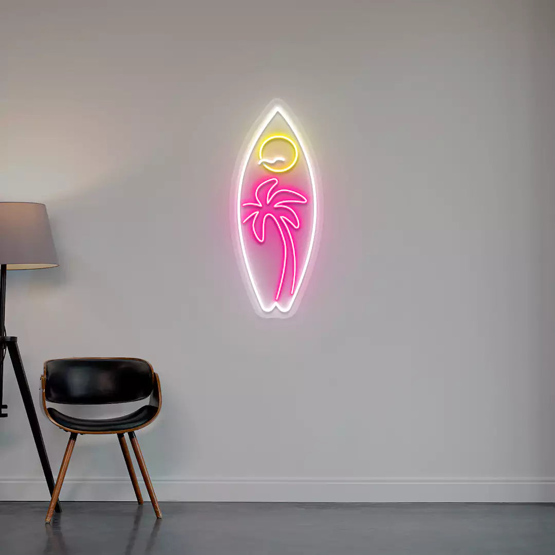 pink yellow and white tropical surfboard neon sign mounted on a wall