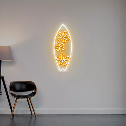 orange and white floral surfboard neon sign mounted on a wall