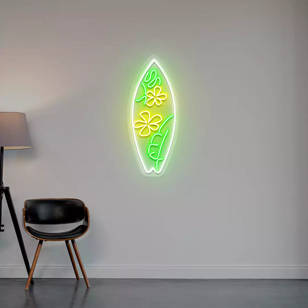 yellow green and white flower surfboard neon sign mounted on a wall