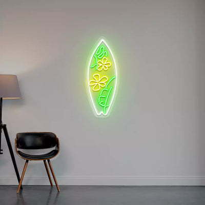yellow green and white flower surfboard neon sign mounted on a wall