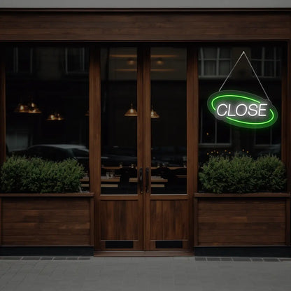 green semi oval close neon sign hanging on a window