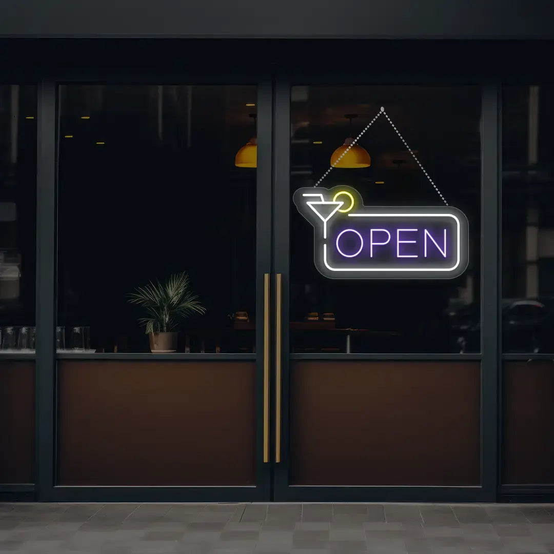 purple martini open neon sign hanging on a window