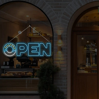 ice blue donut open neon sign hanging on a window