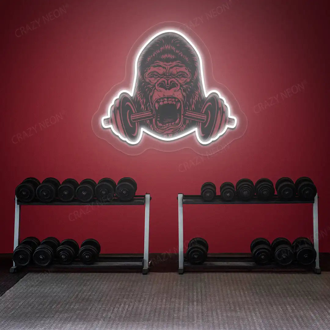 white gorilla barbell gym neon artwork mounted on a wall