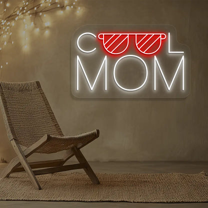 red and white cool mom trendsetter neon sign mounted on a wall