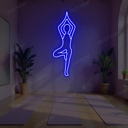 Vrikshasana Yoga Neon Sign lighting up in blue color in a yoga room