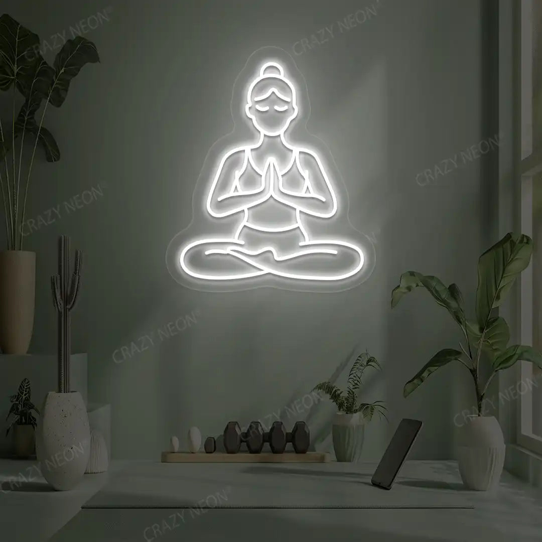 Padmasana Anjali Mudra Yoga Neon Sign lighting up in white color in a yoga room