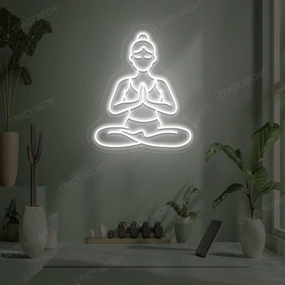 Padmasana Anjali Mudra Yoga Neon Sign lighting up in white color in a yoga room