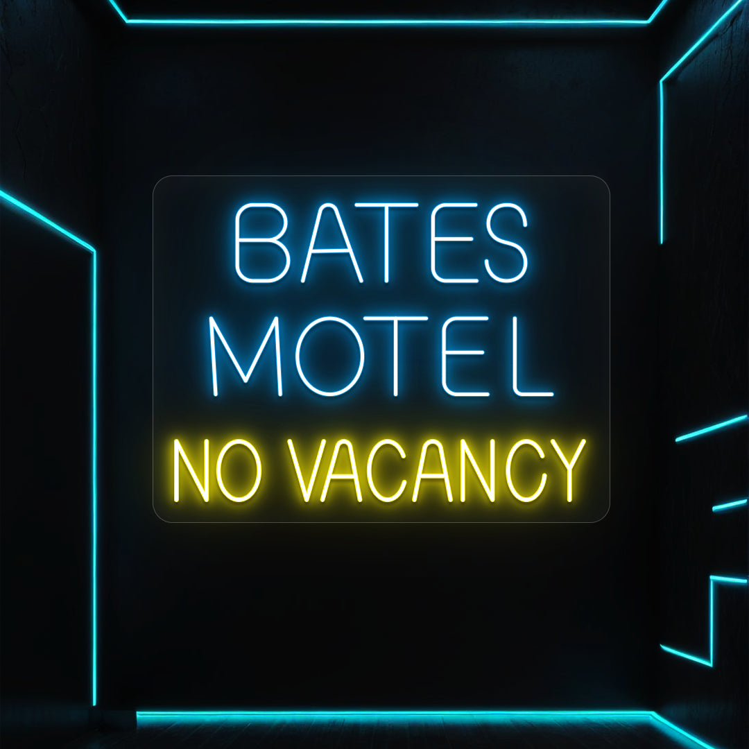 ice blue and yellow bates motel no vacancy vintage neon sign mounted on a wall